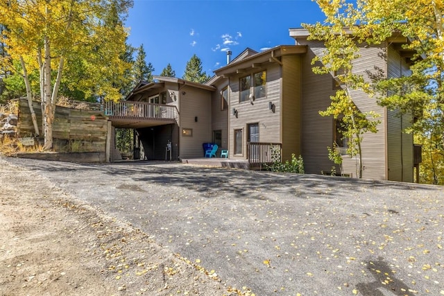 537 Moonstone Rd, Breckenridge, CO 80424 - back of property featuring a deck and driveway