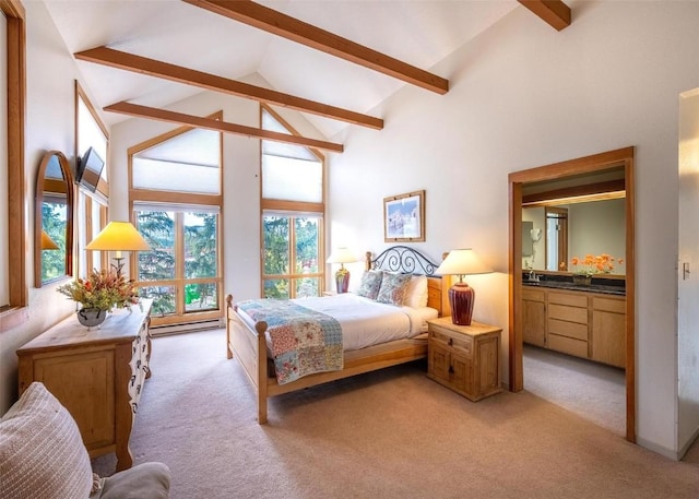 bedroom with beamed ceiling, ensuite bathroom, light carpet, and high vaulted ceiling