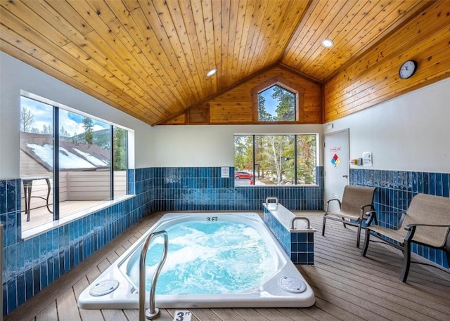 view of pool with an indoor hot tub