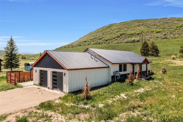 32655 County Road 179, Oak Creek, CO 80467 - back of property featuring a mountain view and a metal roof
