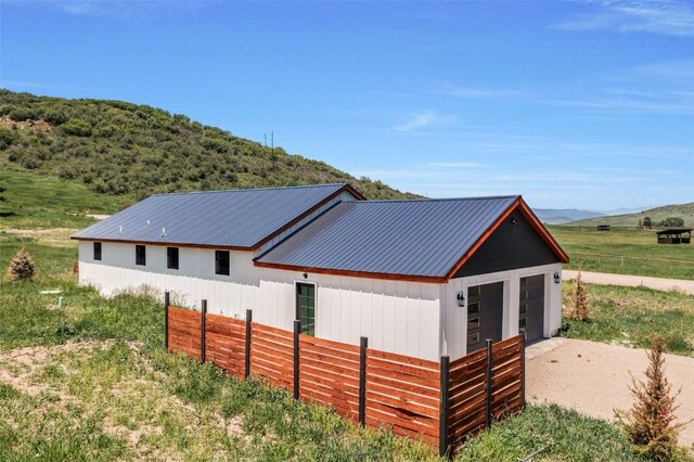 32655 County Road 179, Oak Creek, CO 80467 - snow covered back of property with a metal roof and a mountain view