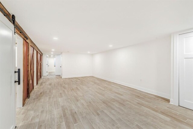 32655 County Road 179, Oak Creek, CO 80467 - living room featuring a barn door, light wood-style flooring, and recessed lighting