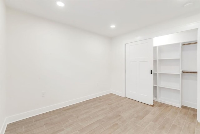 32655 County Road 179, Oak Creek, CO 80467 - unfurnished bedroom with baseboards, a closet, light wood finished floors, and recessed lighting