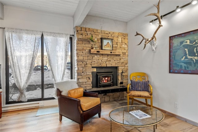 living area featuring wooden ceiling, wood finished floors, and beamed ceiling