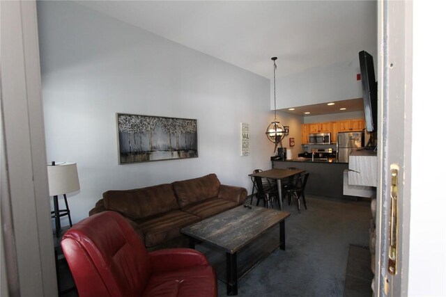 172 Copper Cir Unit 101, Copper Mountain, CO 80443 - living room with dark carpet and vaulted ceiling
