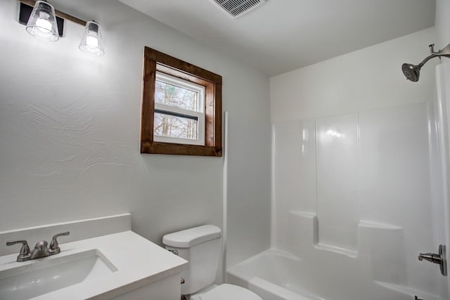 full bathroom with shower / bathing tub combination, visible vents, vanity, and toilet