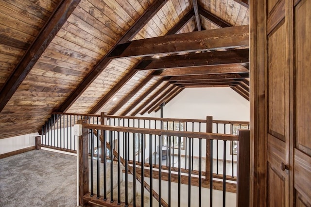 additional living space with lofted ceiling with beams, carpet floors, and wood ceiling