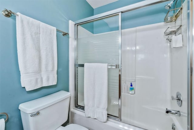 full bath featuring enclosed tub / shower combo and toilet