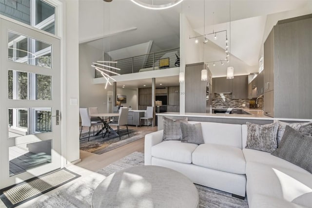 405 Creekside Dr, Frisco, CO 80443 - living area featuring a towering ceiling, track lighting, and light wood finished floors