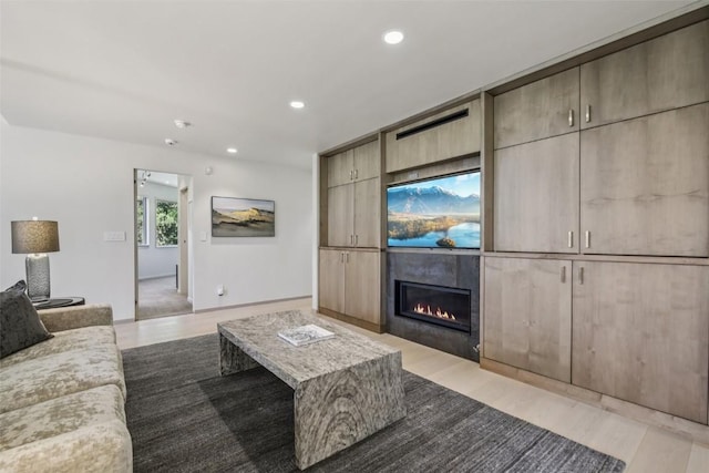 405 Creekside Dr, Frisco, CO 80443 - living area with a glass covered fireplace, recessed lighting, and light wood-style flooring