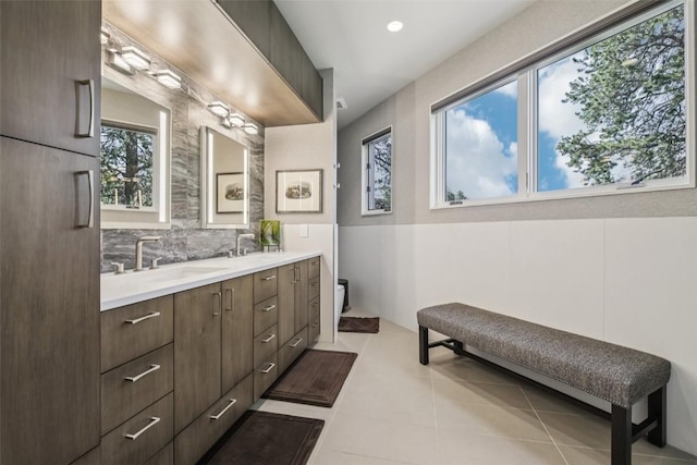 405 Creekside Dr, Frisco, CO 80443 - bathroom with double vanity, tile patterned floors, and tasteful backsplash