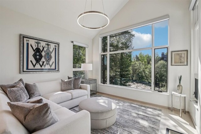 405 Creekside Dr, Frisco, CO 80443 - living room featuring lofted ceiling and a chandelier