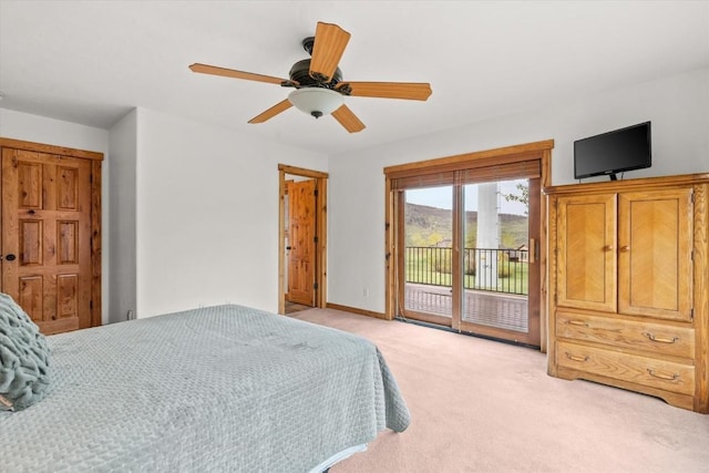 1088 Longview Cir Unit 1, Steamboat Springs, CO 80487 - bedroom with access to exterior, light colored carpet, and a ceiling fan