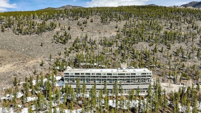aerial view with a view of trees and a mountain view