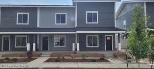 790 Tucker St Unit 790, Craig, CO 81625 - rear view of property featuring a garden and a porch