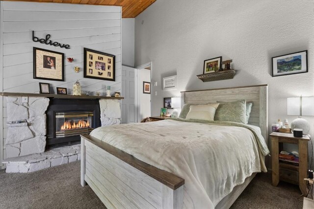 2146 Aster Pl Unit 3, Steamboat Springs, CO 80487 - carpeted bedroom with a glass covered fireplace and wood ceiling
