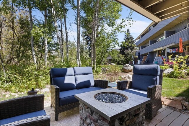 2146 Aster Pl Unit 3, Steamboat Springs, CO 80487 - view of patio / terrace featuring an outdoor living space with a fire pit