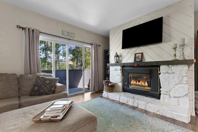 2146 Aster Pl Unit 3, Steamboat Springs, CO 80487 - living room featuring wood finished floors and a fireplace