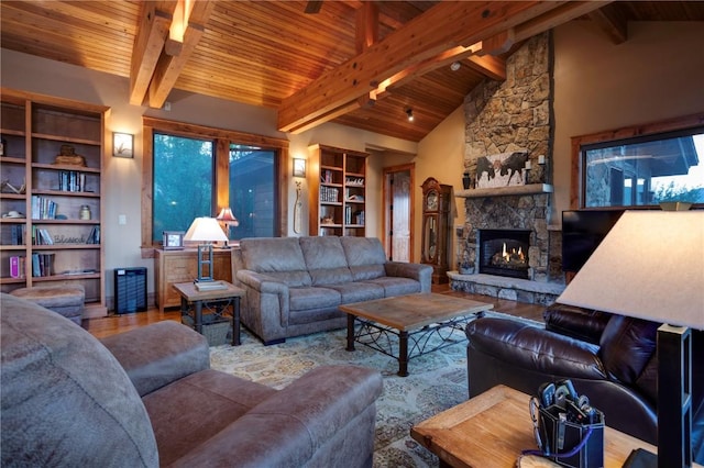 35525 Humble Rd, Steamboat Springs, CO 80487 - living area featuring wood ceiling, wood finished floors, a stone fireplace, and built in shelves
