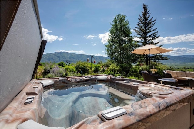 35525 Humble Rd, Steamboat Springs, CO 80487 - view of swimming pool with a mountain view and a hot tub