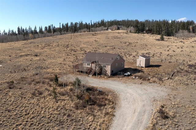 birds eye view of property with a rural view