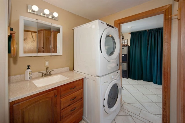 laundry room with light tile patterned floors, laundry area, stacked washer / dryer, and a sink
