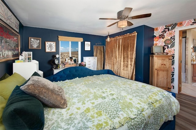 bedroom featuring wood finished floors and ceiling fan