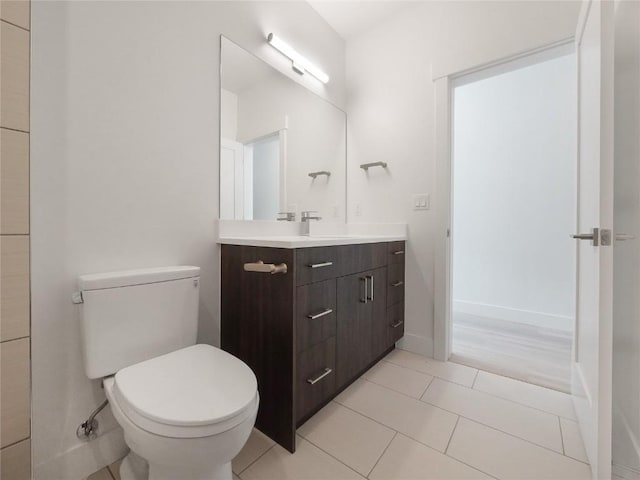 740 Blue River Pkwy Unit A22, Silverthorne, CO 80498 - bathroom with vanity, toilet, tile patterned floors, and baseboards