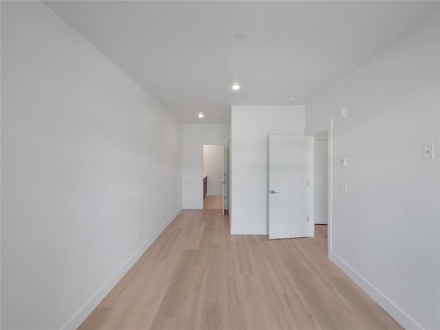 740 Blue River Pkwy Unit A22, Silverthorne, CO 80498 - unfurnished room with light wood-type flooring, baseboards, and recessed lighting