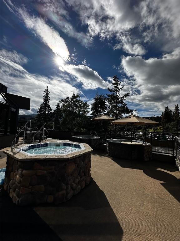 601 Village Rd # 501, Breckenridge, CO 80424 - view of pool featuring a patio and an in ground hot tub