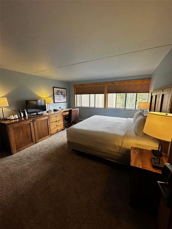 601 Village Rd # 501, Breckenridge, CO 80424 - carpeted bedroom featuring lofted ceiling