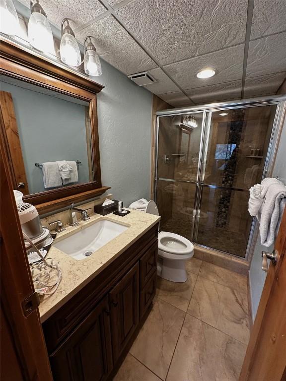 601 Village Rd # 501, Breckenridge, CO 80424 - full bath with vanity, toilet, a stall shower, and visible vents