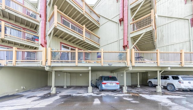 view of building exterior with covered parking