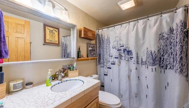 bathroom featuring toilet, a shower with curtain, and vanity