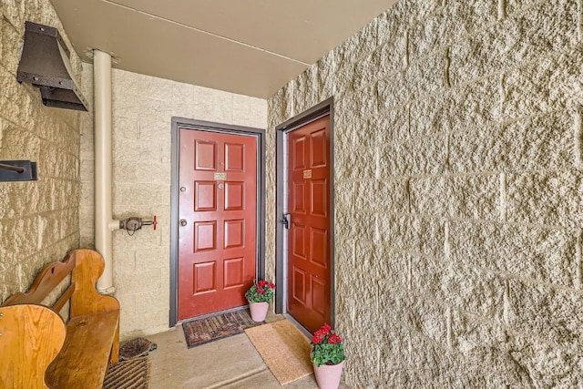 entrance to property with stucco siding