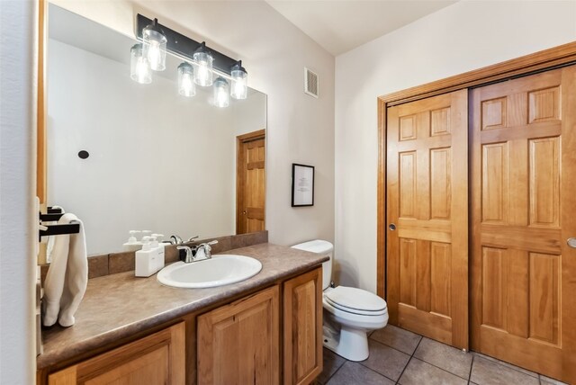 850 Blue River Pkwy Unit E5, Silverthorne, CO 80498 - bathroom featuring toilet, tile patterned floors, visible vents, and vanity