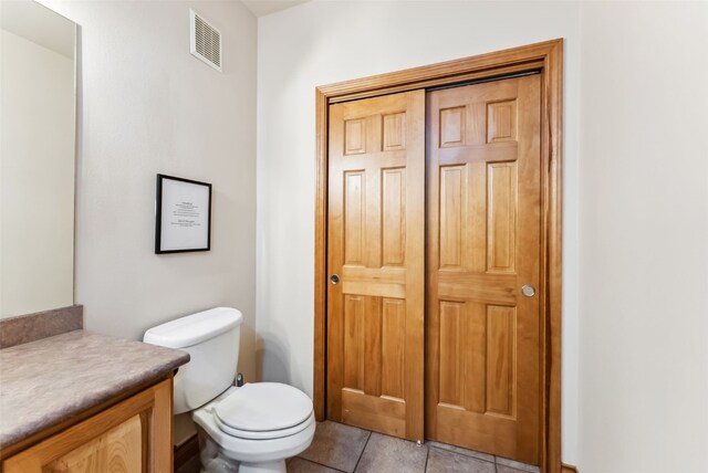 850 Blue River Pkwy Unit E5, Silverthorne, CO 80498 - bathroom featuring visible vents, tile patterned floors, toilet, and vanity