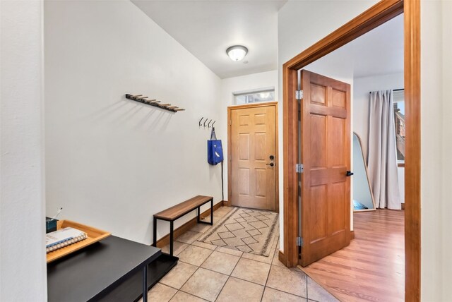 850 Blue River Pkwy Unit E5, Silverthorne, CO 80498 - entryway with baseboards and light tile patterned floors