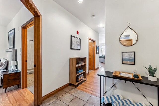 850 Blue River Pkwy Unit E5, Silverthorne, CO 80498 - hall featuring baseboards, recessed lighting, and light tile patterned floors