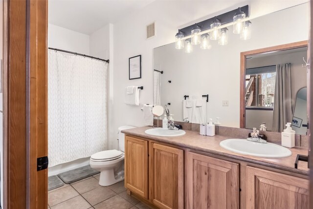 850 Blue River Pkwy Unit E5, Silverthorne, CO 80498 - full bath with double vanity, tile patterned floors, visible vents, and a sink
