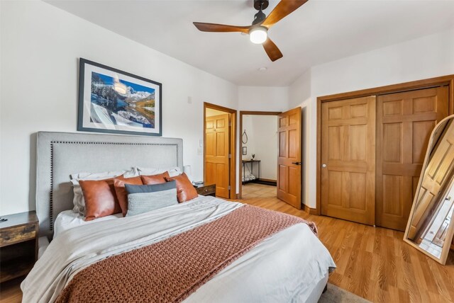 850 Blue River Pkwy Unit E5, Silverthorne, CO 80498 - bedroom with a ceiling fan, a closet, and light wood-style flooring