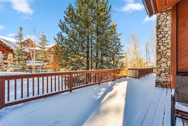 view of snow covered deck