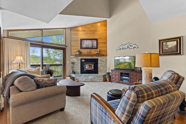 1675 Ranch Rd Unit 410, Steamboat Springs, CO 80487 - living room with high vaulted ceiling, a fireplace, and wood finished floors