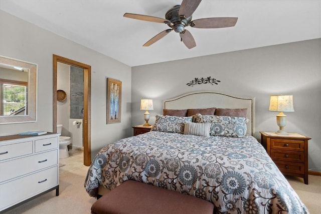 1675 Ranch Rd Unit 410, Steamboat Springs, CO 80487 - bedroom with light carpet, ensuite bath, baseboards, and a ceiling fan