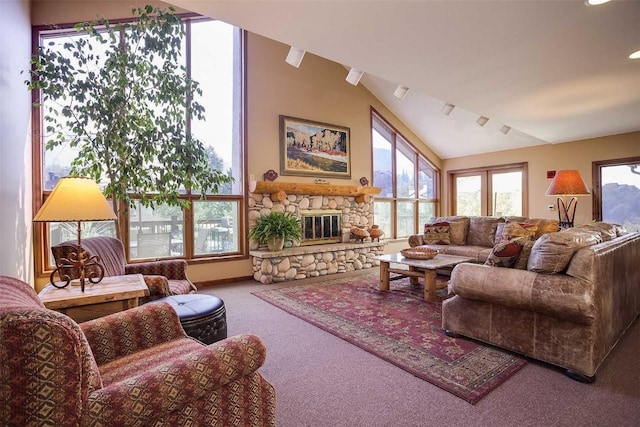 1675 Ranch Rd Unit 410, Steamboat Springs, CO 80487 - carpeted living area featuring vaulted ceiling, a stone fireplace, and recessed lighting
