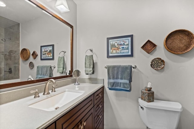 1675 Ranch Rd Unit 410, Steamboat Springs, CO 80487 - bathroom with vanity, toilet, and a tile shower