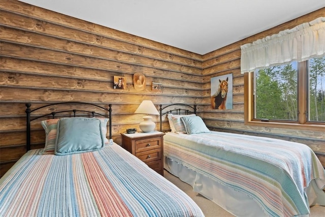 1675 Ranch Rd Unit 410, Steamboat Springs, CO 80487 - bedroom featuring rustic walls and carpet flooring