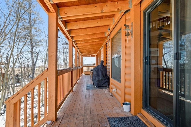 view of snow covered deck