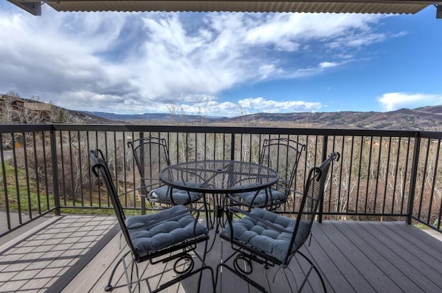 2626 Longthong Rd Unit 203, Steamboat Springs, CO 80487 - deck featuring a mountain view and outdoor dining area