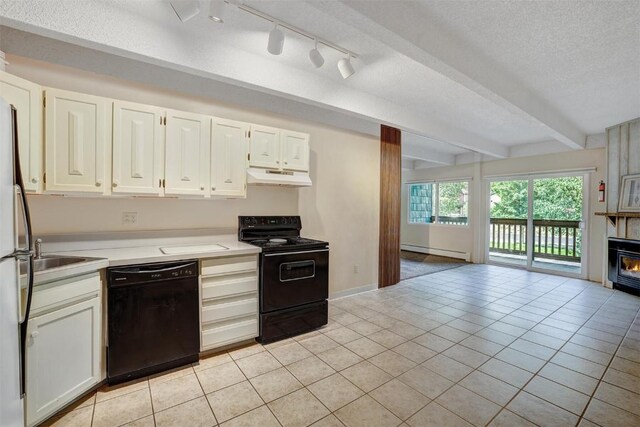 200 Granite St Unit 202, Frisco, CO 80443 - kitchen featuring a baseboard heating unit, black appliances, open floor plan, light countertops, and under cabinet range hood